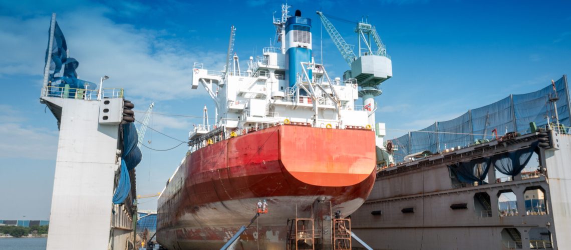 The hull painting consists of washing, blasting and painting of the vessel cargo ship by operator at international dry dock concept maintenance service annual cleaning.